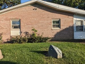 Brick home with grassy catio