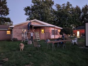 DIY catio construction underway at night
